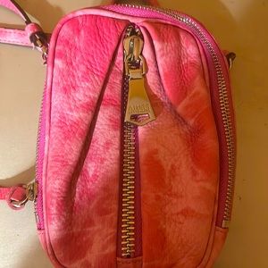 I am selling a Aimee kestenberg bag it is a cross body, it is pink and holdable